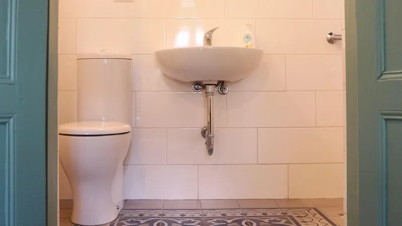 Clean bathroom with patterned floor tiles