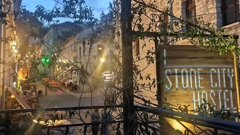 Evening on the balcony above the lit-up old town street