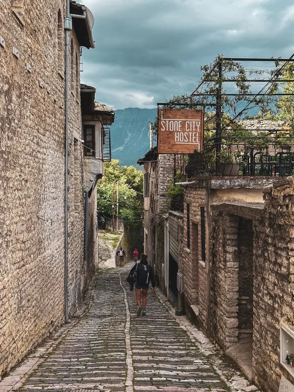 Cobbled lane in the old town below the Stone City Hostel sign
